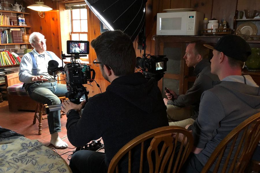 Andrew and crew filming an interview with Joel Salatin in his farmhouse kitchen